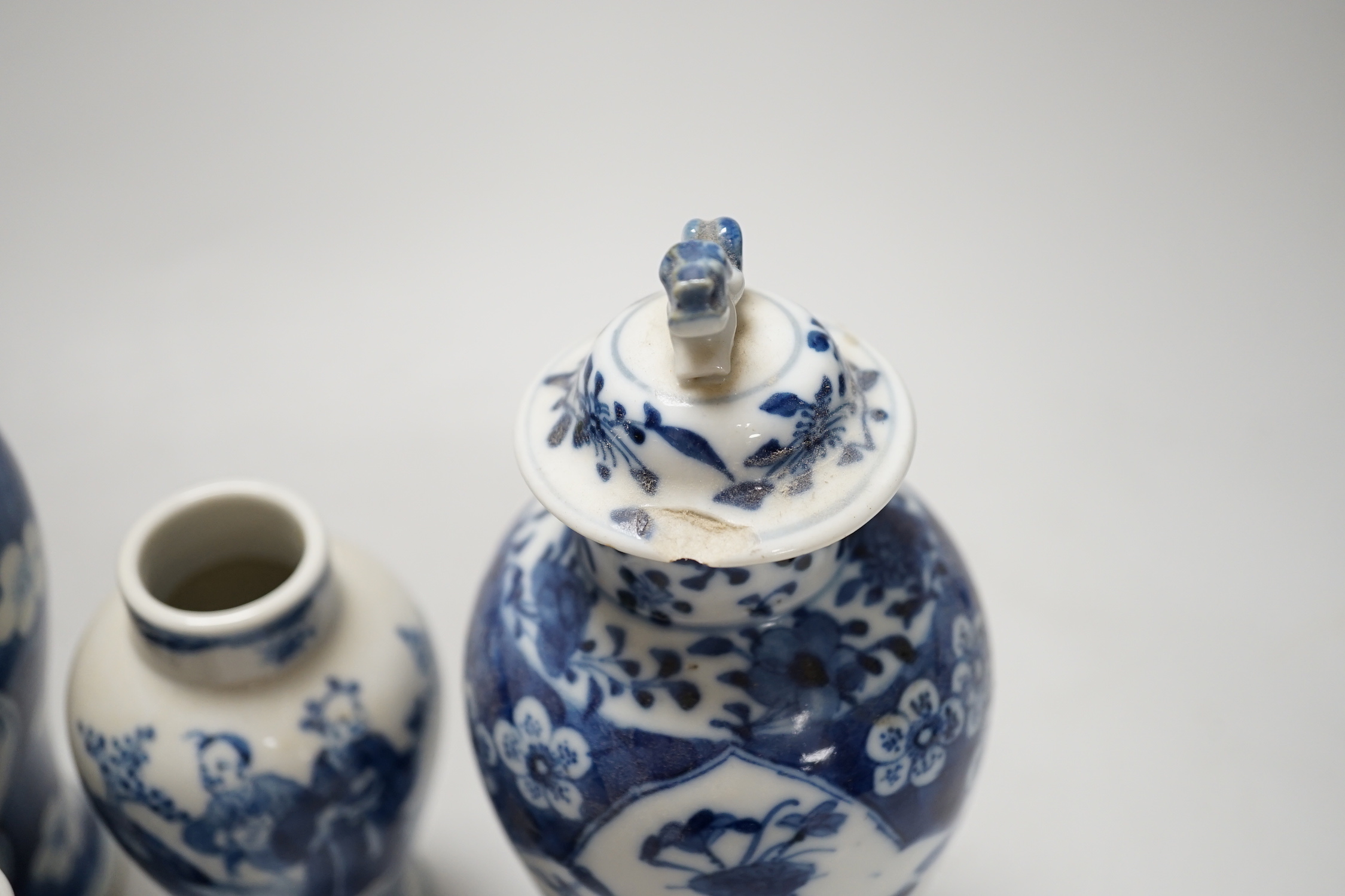 A Chinese armorial blue and white bottle vase, Qianlong/Jiaqing period, and five assorted 19th century Chinese blue and white vases, tallest 20cm; faults